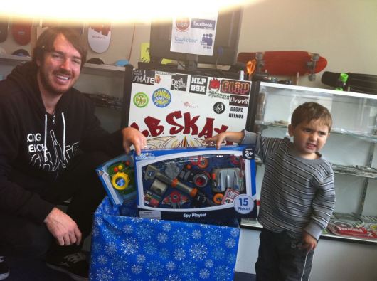 One of T's friends drops a toy off for Autism In Long Beach at Long Beach Skate. This little dude is two-years-old, proof that it's never too young to start a lesson on giving.