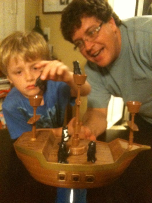 C helps T keep a steady hand during a game of "Don't Rock the Boat."