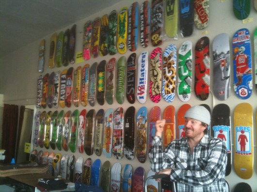 Owner Tim Scanlon decks the walls of Long Beach Skate with the latest designs.