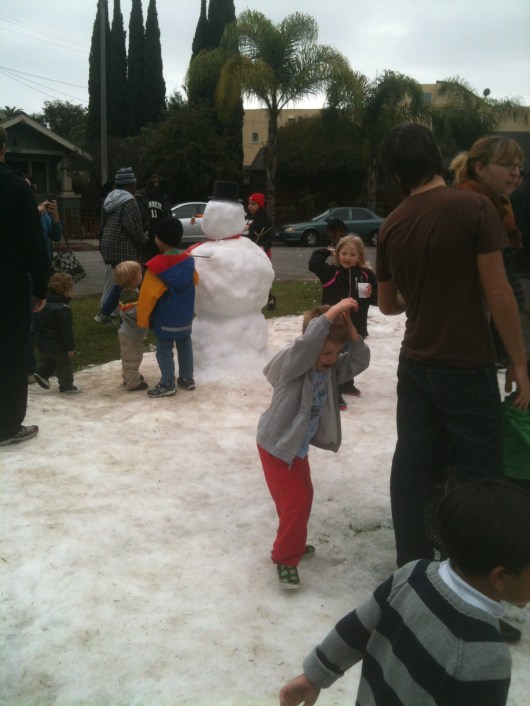 T on the receiving end of a snow ball or two at Saturday's "Snow Day" in Rose Park (Long Beach, CA).