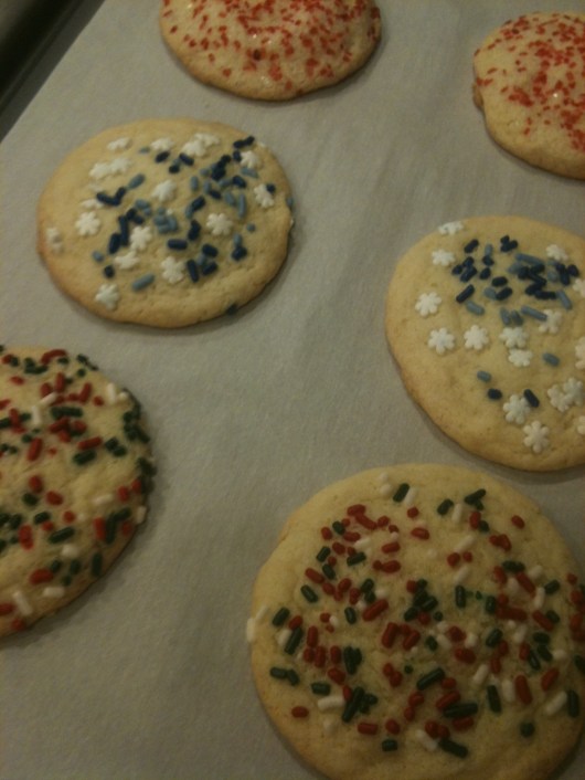 After rolling the scooped balls of cookie dough in various sprinkle types, they bake up beautifully and ready to eat! No icing necessary!