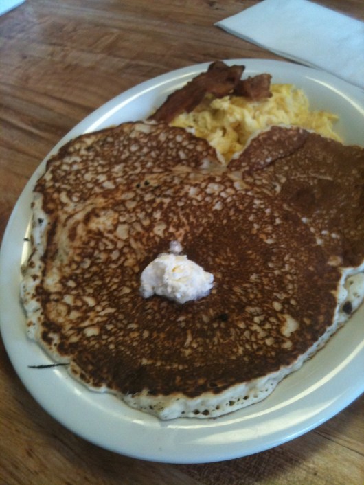 T's "kid's breakfast" of an extra-large pancake, eggs, and bacon at Hawaiian Style Cafe.