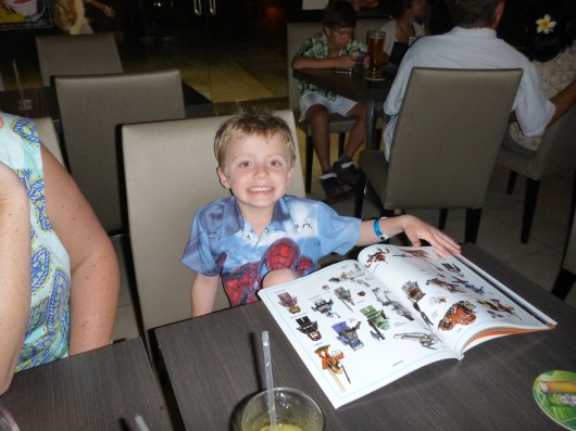 While C and I enjoyed a lovely New Year's cocktail hour and leisurely meal, T did his LEGO Star Wars sticker book. Atta boy, T!