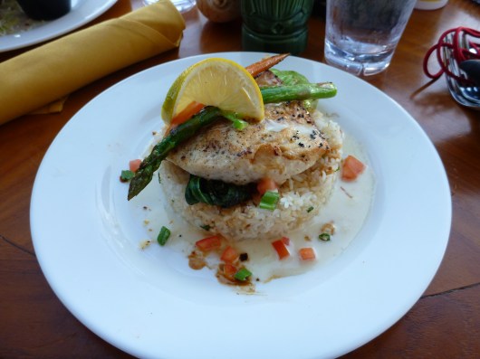 A local pink snapper over baby bok choi and a pillow of rice, the daily special at Lava Lava Beach Club.