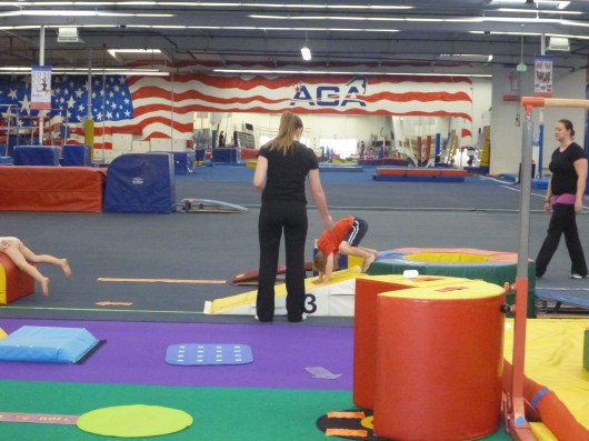 Nice somersault form, T! Even the instructors said that T did great during his first class. Thank goodness for all that Power Play Kids' Gym we did in preschool!