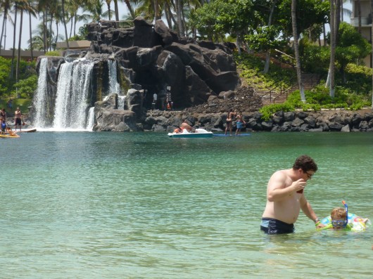 C takes T into the shallows of the Hilton Waikoloa Village's lagoon (Spring 2012). We started T out snorkeling inside of a floatie ring where he could still touch bottom. It was a perfect way (and place) to introduce the hobby to a four-year-old.
