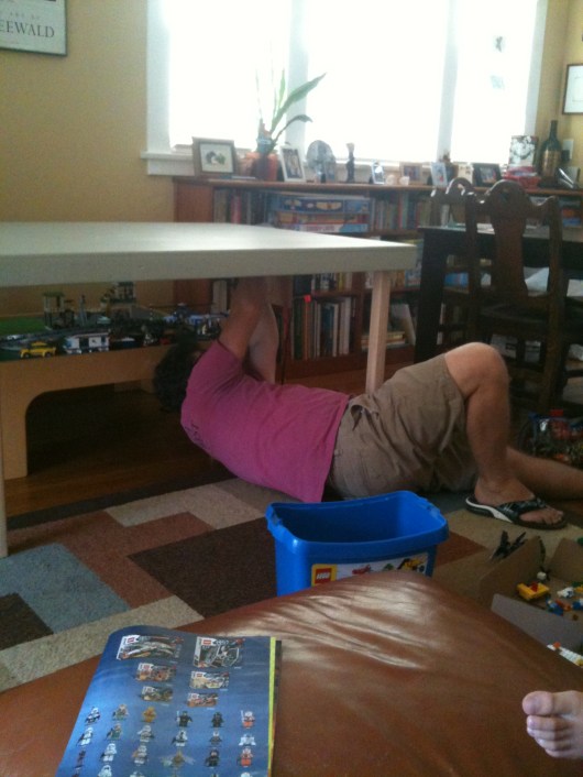 C installs the transformer onto the side of the newly constructed train table. He even ran an outlet directly to the table for it to plug into. Good thing C is handsome AND handy!