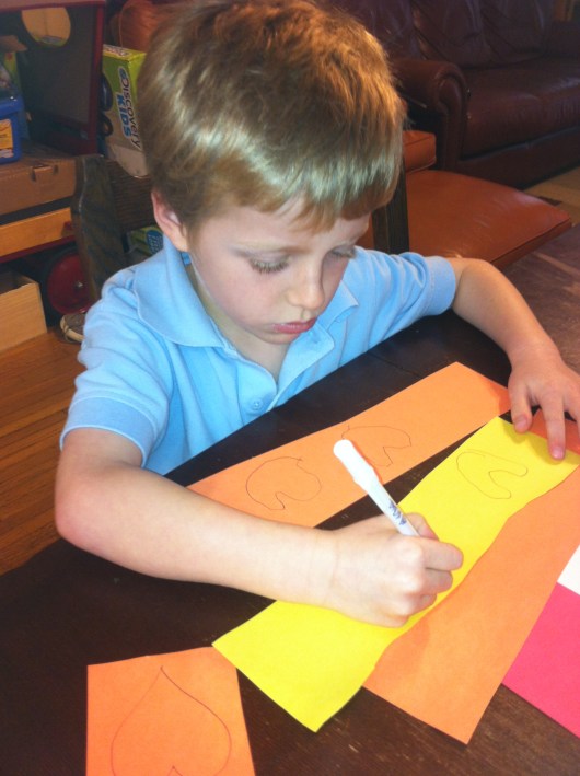 T had a homework assignment this month to draw, cut, and paste hearts.