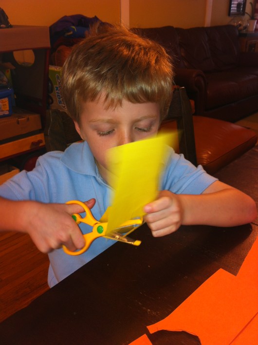 T cutting out the hearts he drew free-hand.