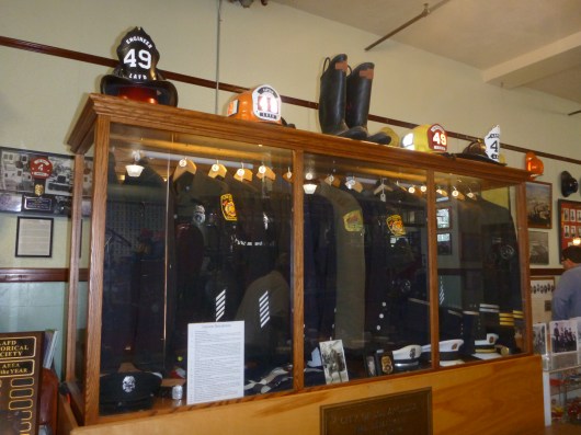 Uniforms over the years on display at LAFD Harbor Museum.