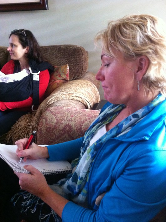 A mom takes notes during Kathy Salazar's "Practical Parent Talk" Friday.