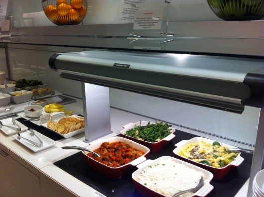 Hot appetizers and entrees in the oneworld First Lounge at LAX.