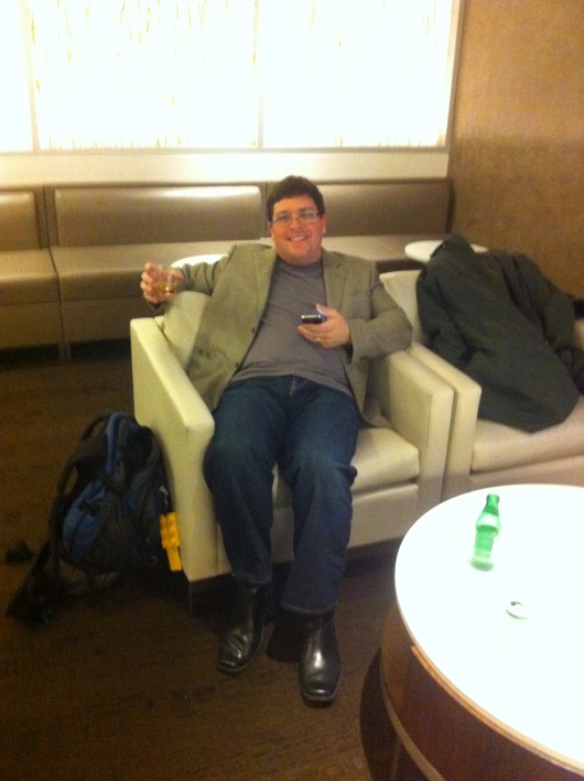 C relaxing into vacation mode in the oneworld first-class lounge at LAX.