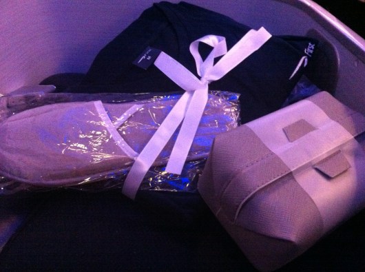 Free gifts for all in BA's First cabin consist of a set of pajamas, slippers, and a personal toiletries kit from the skin-care line Ren.