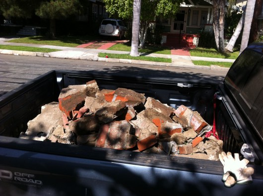 C said the wreckage weighed in at over a ton when he and T took it down to the dump last Saturday. Who knew a little brick wall weighed so much?!