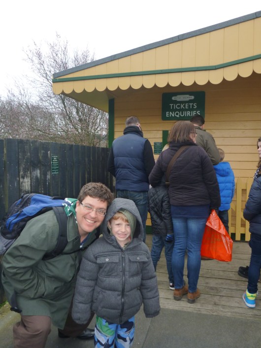 C and T in front of the steam train ticket window. C made sure our ticket package included those tickets also (which it did).