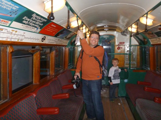 C and T inside an old Tube car at the London Transport Museum.