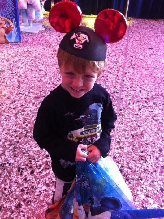 T with his cotton candy and ears, all part of our Disney on Ice traditions here at home in Long Beach (CA).