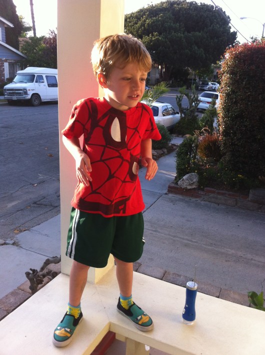 T doing the "robot" while listening to the song "Bust a Move" on his new transistor radio/flashlight while wearing his new Perry the Platypus shoes. I still remember my transistor radio from around five-years-old, so this is an awesome tradition I feel I am passing down. But now transistor radios are called emergency radios and come with built-in scanners and flashlights. Ah, changes!