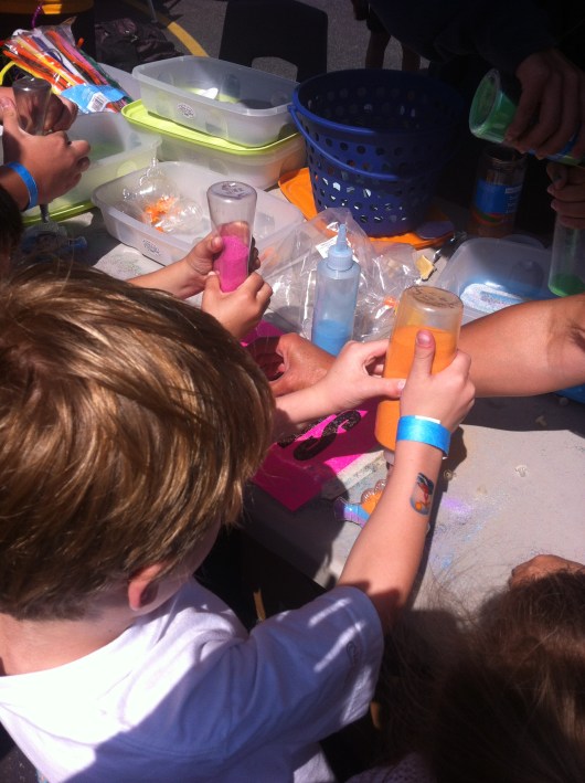 T making a sand craft at his school carnival.