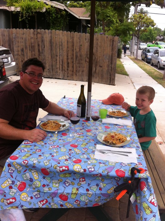 C and T sitting down to the first al fresco dinner in our newly remodeled front yard. Thanks to C for all of his hard work the last three months! Now, have a drink!