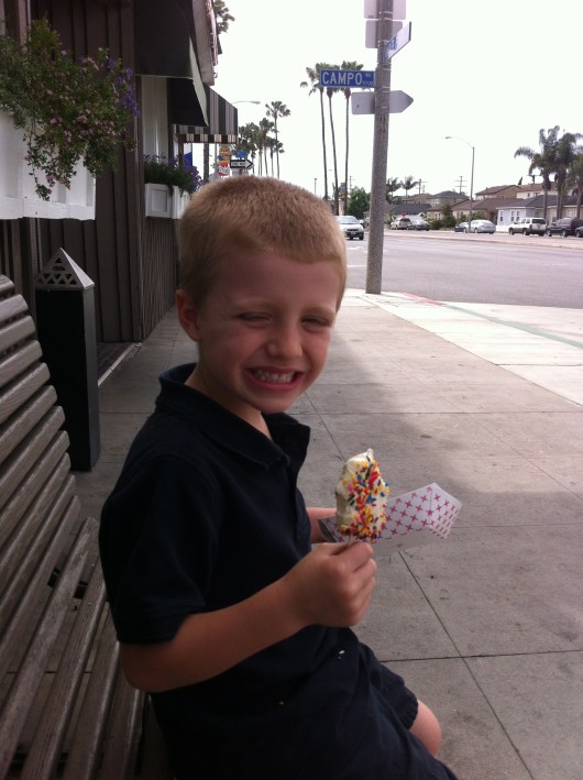 T on a bench outside Naples Rib Company enjoying his Naples Bar. While not exactly the same as eating along the sidewalk on Balboa Island, we're still on a bench on an island. We'll take it!