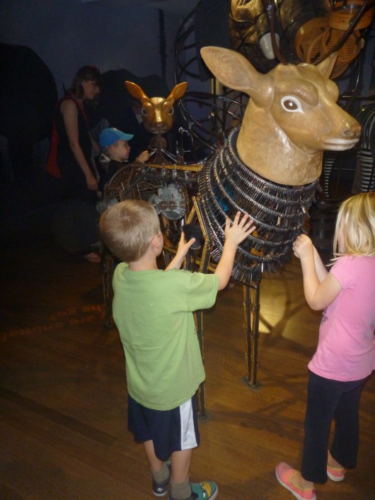 T touches old keys and other recycled materials that now make up animals inside of the Noah's Ark exhibit at the Skirball Cultural Center.