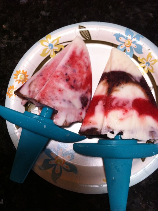 A couple of the finished red-white-and-blue Greek yogurt and berry ice pops. I am sad to say that they look MUCH better than they tasted.