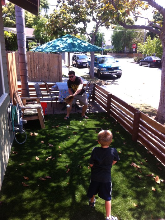 T and C playing catch in the new front yard!