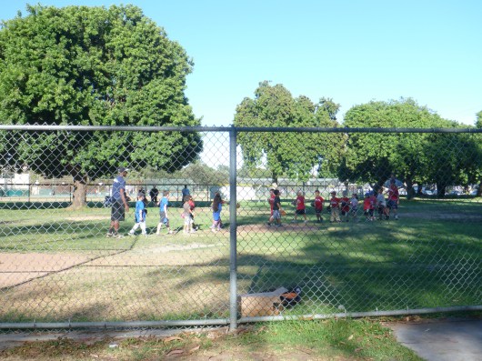 Great game, everyone! No, they don't keep score (it's a bit too chaotic for all that), but the kids are having a great time learning about the game and having fun this summer!