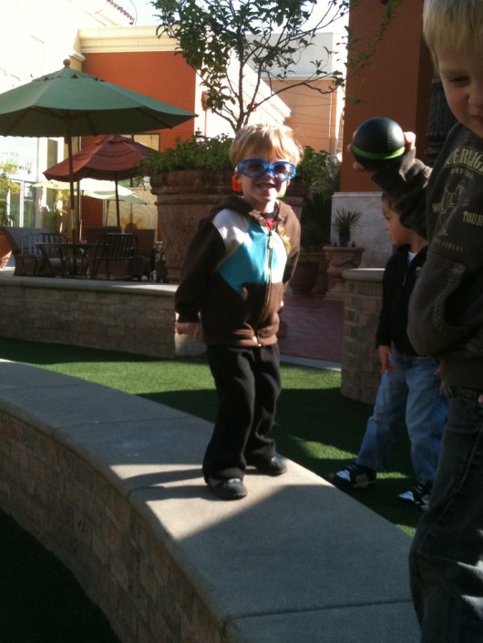 A 3-year-old T is getting his pre-show sillies out at Bella Terra (January 2011).
