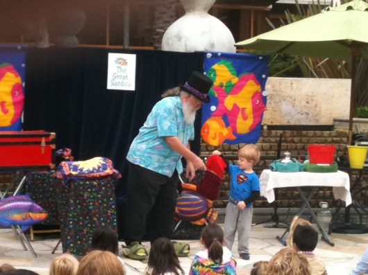 T up on stage with a magician during summer 2011 at Bella Terra Kids' Club.
