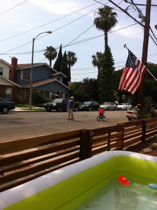 C scooted as T biked for the first time on the street this summer.