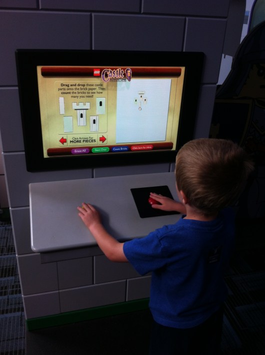 T made plans at this engineering kiosk inside the LEGO Castle exhibit at the Discovery Science Center.