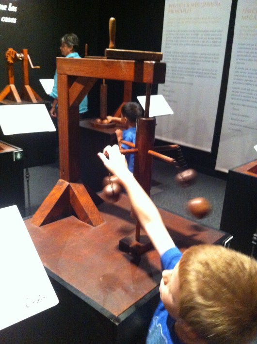 T putting his hands on some of the DaVinci models inside of the special exhibit on now at the Discovery Science Center.