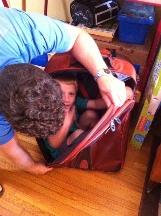 T wanted to get into this suitcase and have C pull him around. Sometimes that's all it takes to keep a kid happy, RMT'ers!