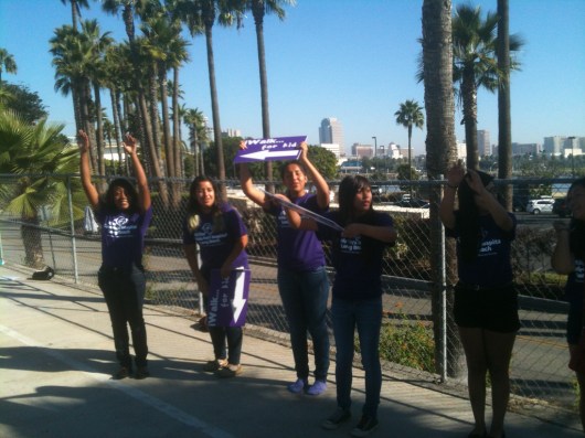 Go, go, go! These volunteers are cheering you on to get online and register for the 2013 iWalk... for Kids today!