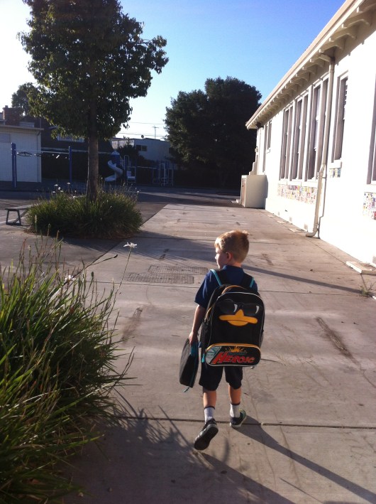T making his way to the Kindergarten play yard.