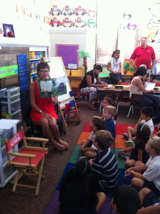 T front and center and on an orange square. I really REALLY hope that is his place on the rug for the entire year. It would make him so happy to be up front AND on an orange square. By the way, his teacher Mrs. K read a book called "The Kissing Hand" about some raccoon who didn't want to go to school. All I kept thinking as the story went on was why even put this idea into their minds. However, it ended in a lovely way as we parents then kissed our children's hands before leaving them on the first day of school. And surprisingly that didn't even get me choked up!