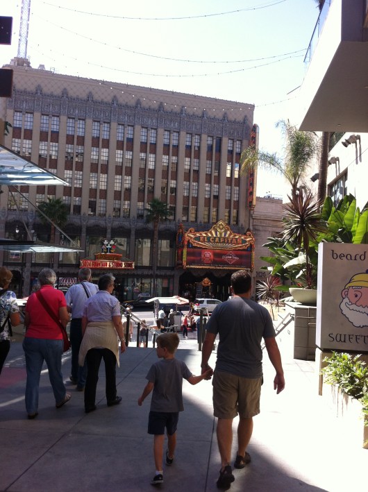 T and C walking down from Hollywood and Highland (where we parked) toward the El Capitan, which is across the street from the mall.
