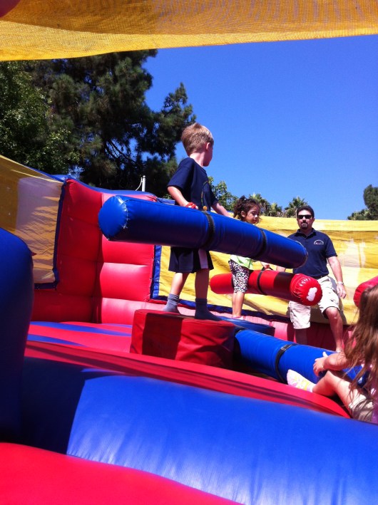 Next up, the kids got to take a whack at cancer in the battle bounce house.