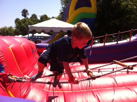 T tackles the horizontal ladder jump.