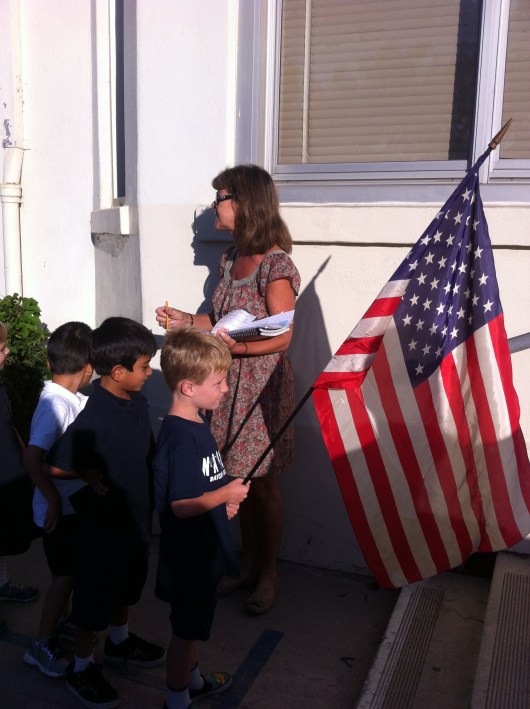 T's first in line, which means it's his turn to hold the flag for Monday assembly!