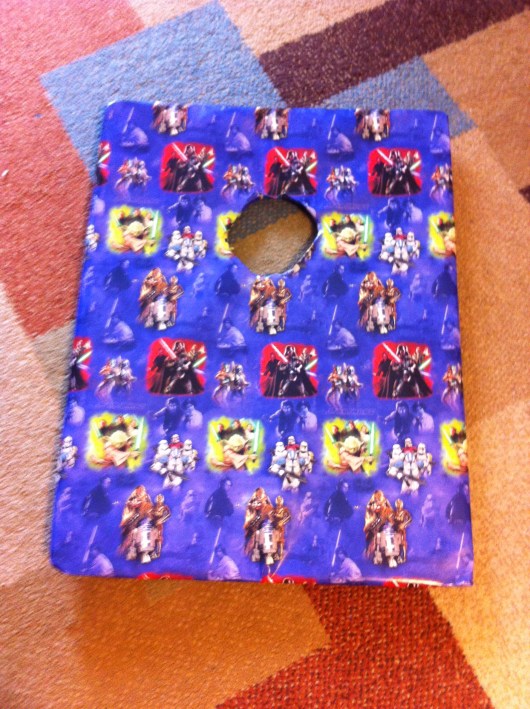 If you have "corn hole" or bean bag toss boards, simply cover them with gift wrap that coordinates with your party's theme. T even created a new game called "Death Star Corn Hole" to match his Star Wars party!