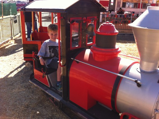 If anything, we go to Pa's each season so T gets to drive that red train! Hard to believe this is his 6th season riding this train!