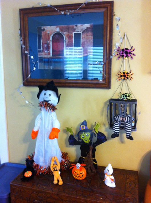 Some of our Halloween decorations in action, including that motion-sensor skeleton in a cage (thanks Grandma Beep for the Halloween gift that keeps on giving season after season!).