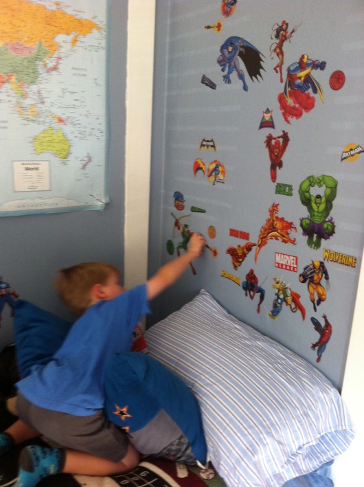 Bye, bye superheroes! T's ready to move on. Thankfully, RoomMates wall decals make room redecorating easy.