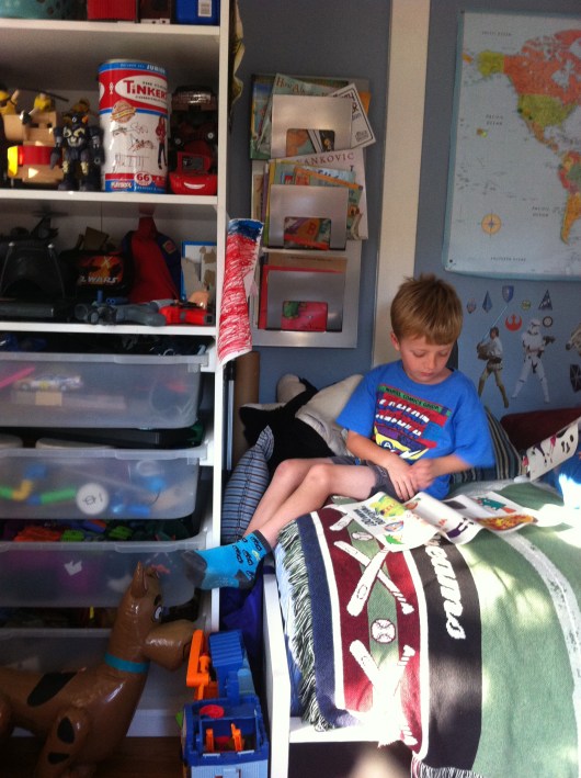 T ponders which sticker to stick up next.