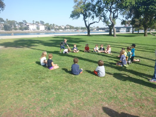 T and his friends playing "Jedi, Jedi, Sith." This is just like "Duck, Duck, Goose" except T changed the words to match his Star Wars party theme.