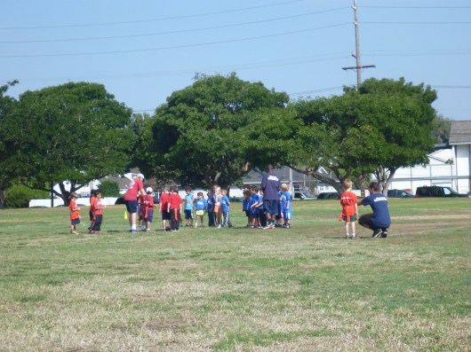 T gets a play call from Coach Chris. It's not at all obvious who's going to be in on the next play... no, not at all! Ha!